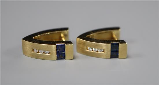 A stylish pair of 585 yellow metal, diamond and gem set earstuds.
